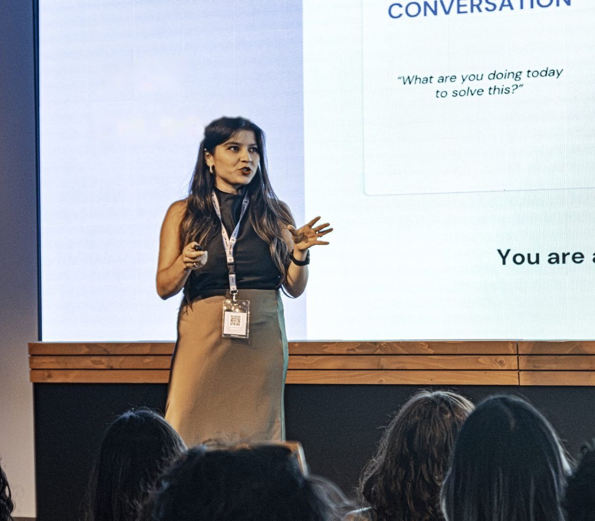 Chiara Bolzon speaking on stage at an event